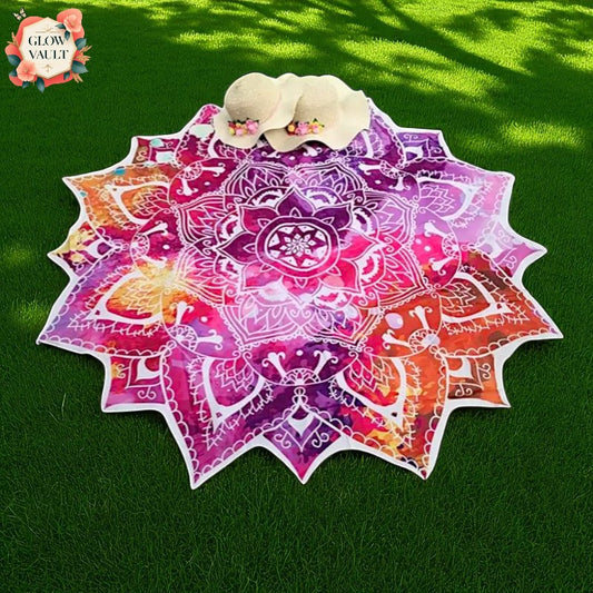 Colorful mandala-patterned towel on a grassy background with 'Glow Vault' branding.