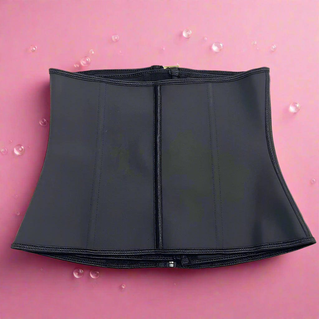 Black waist trainer on a pink bubbly background
